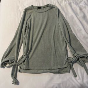 Green long sleeve with bow tie on wrist